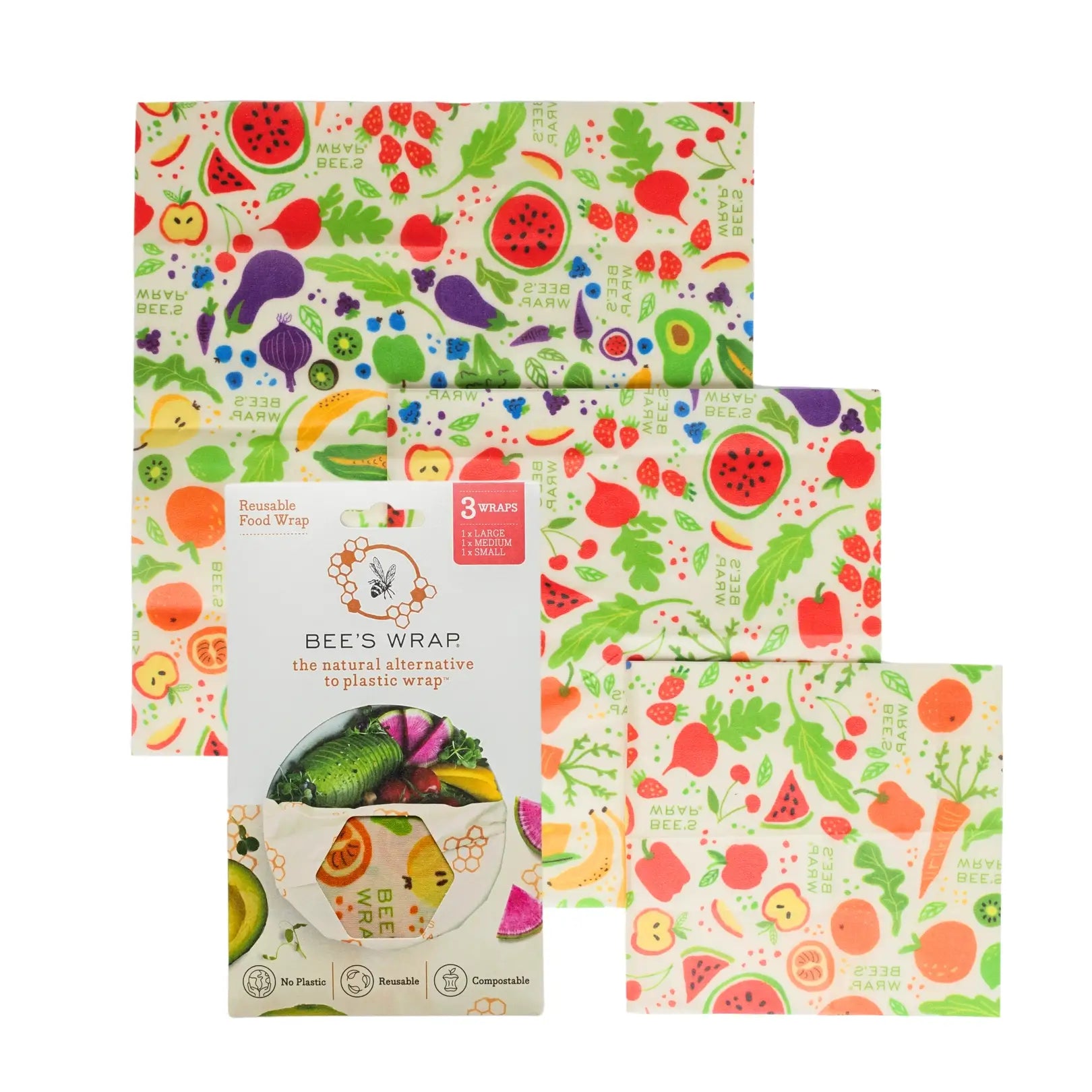 Set of reusable food wraps with colorful fruit and vegetable patterns on a white background.