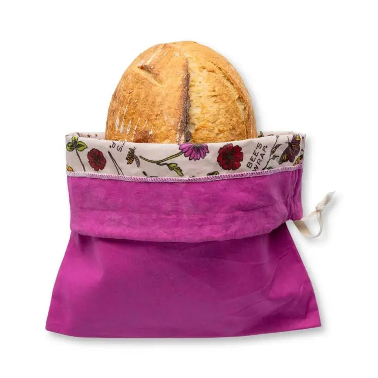 Purple reusable bag with a loaf of bread on a white background