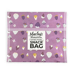 Purple snack bag with fruit pattern and 'Marley's Monsters' branding on a white background