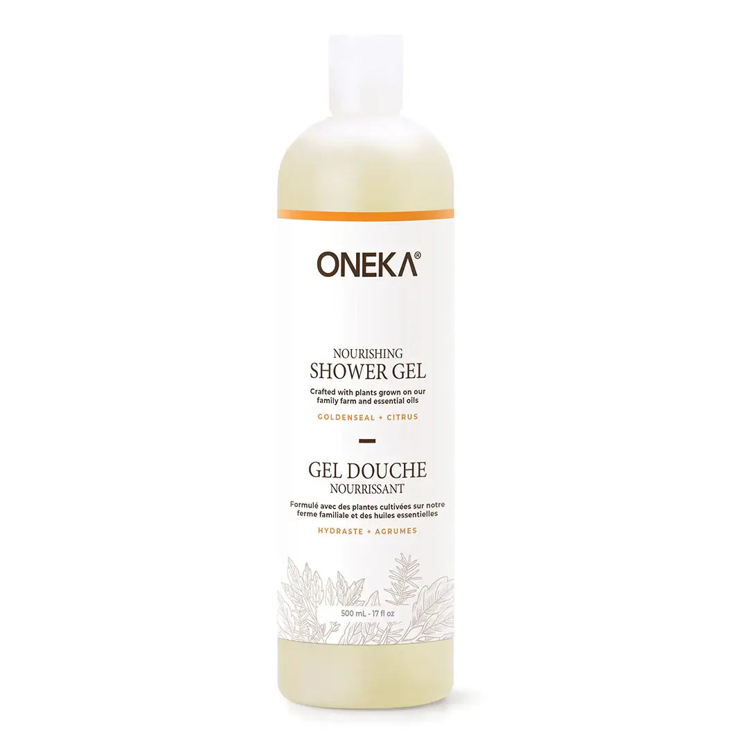 A 500 mL bottle of ONEKA Nourishing Shower Gel, featuring a white label with orange and black text, and a translucent cap, set against a plain white background.