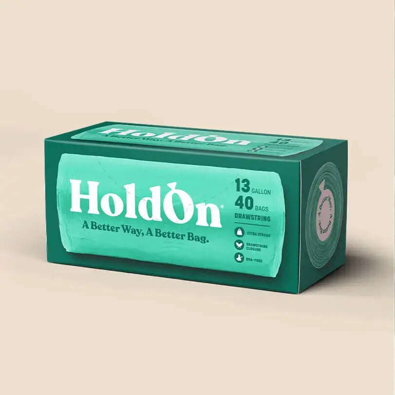 Green box of HoldOn bags on a beige background