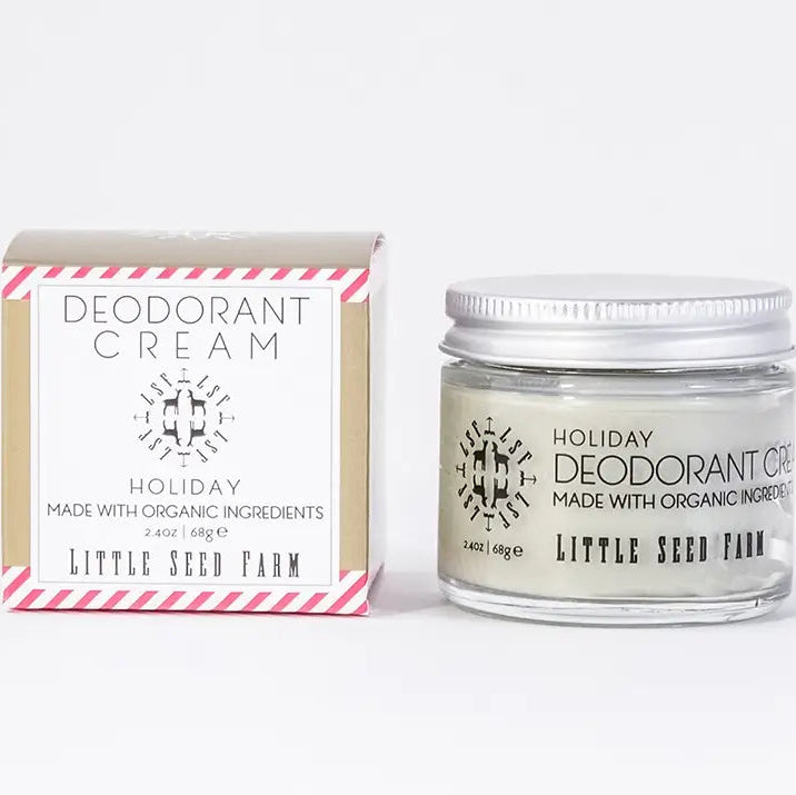 Jar of 'Holiday Deodorant Cream' by Little Seed Farm next to its packaging on a white background