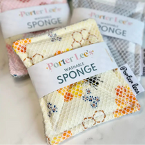 Porter Lee's washable sponges with floral patterns on a marble surface