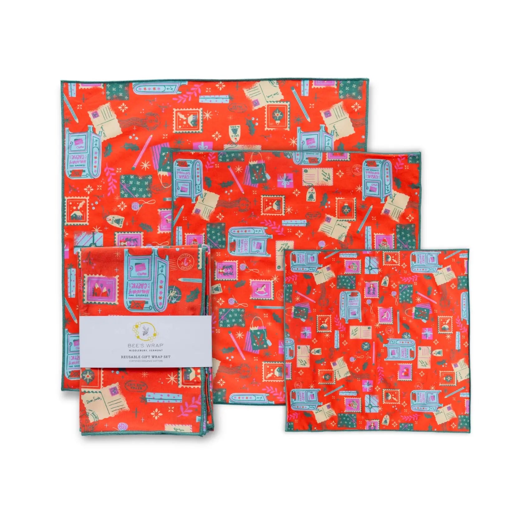 Set of red gift wrap sheets with colorful patterns on a white background