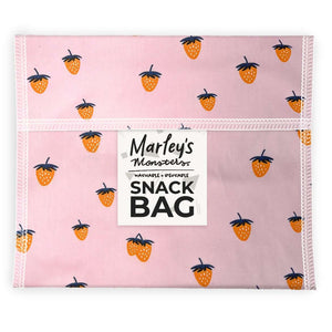Pink snack bag with black and orange designs on a white background