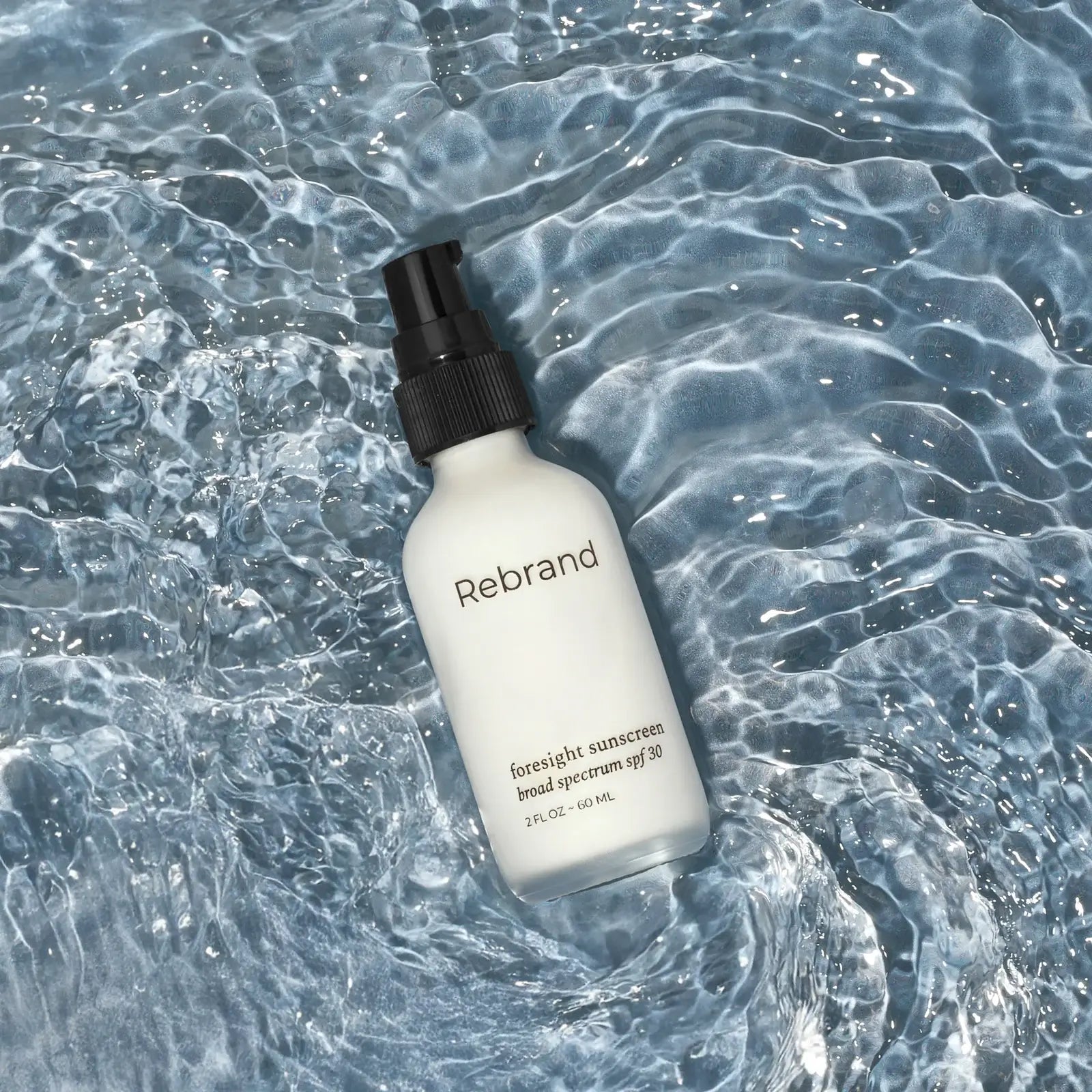 Rebrand sunscreen bottle on water