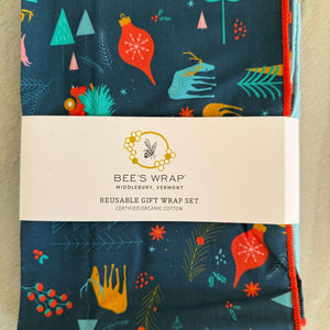 Set of 4 Reusable fabric gift wraps with holiday prints on dark blue organic cotton fabric