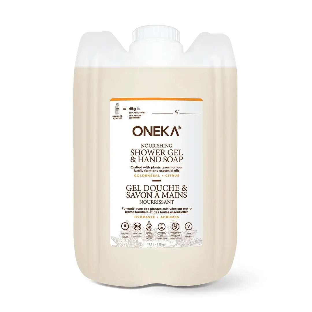 A large jug of ONEKA Nourishing Shower Gel & Hand Soap in a light beige/cream color, featuring a white label with orange and black text, on a clean white background.