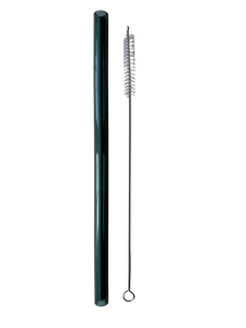 Green glass straw and cleaning brush on a white gray background