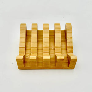 Wooden knife block with multiple slots on a white background