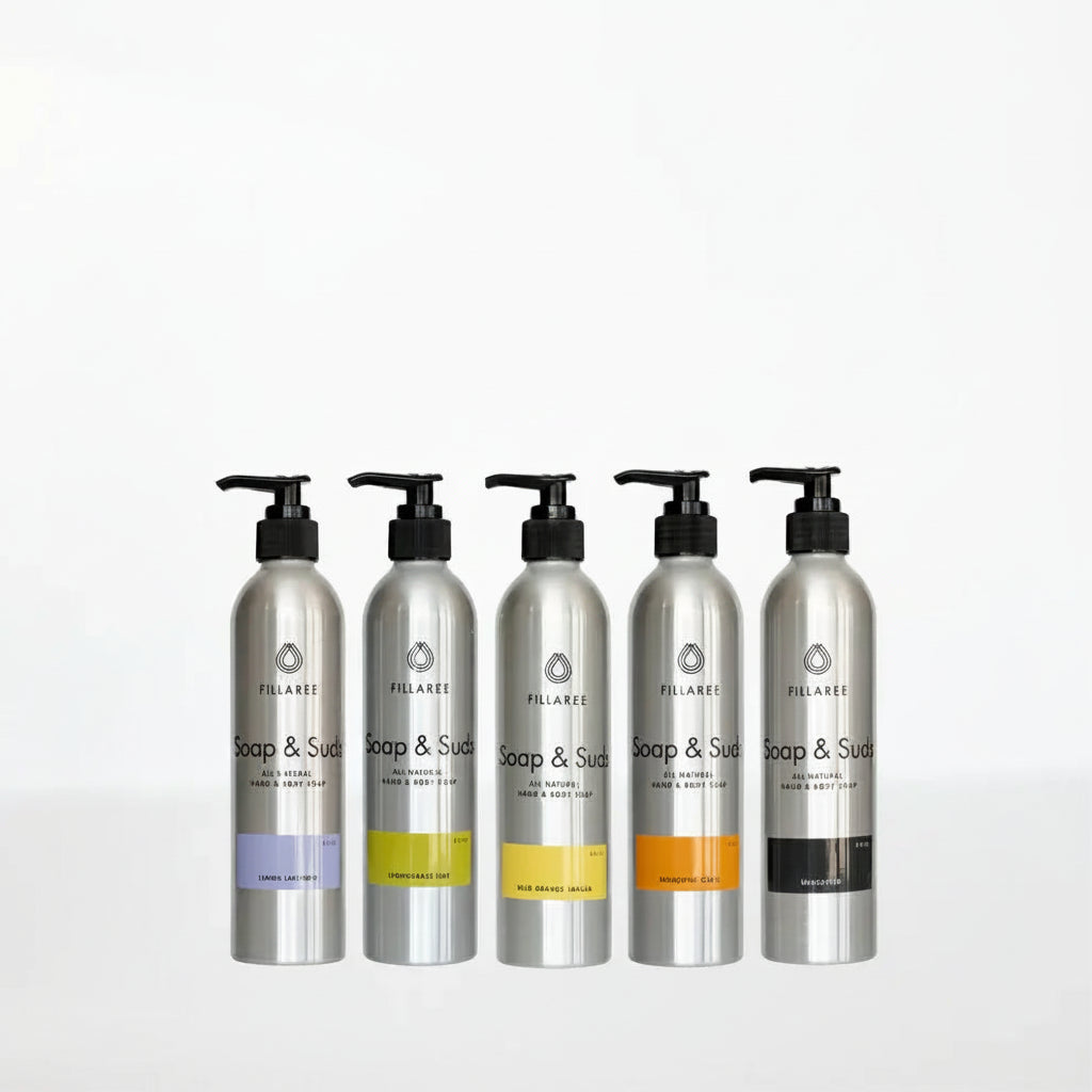 Five aluminum bottles of soap and suds on a white background.