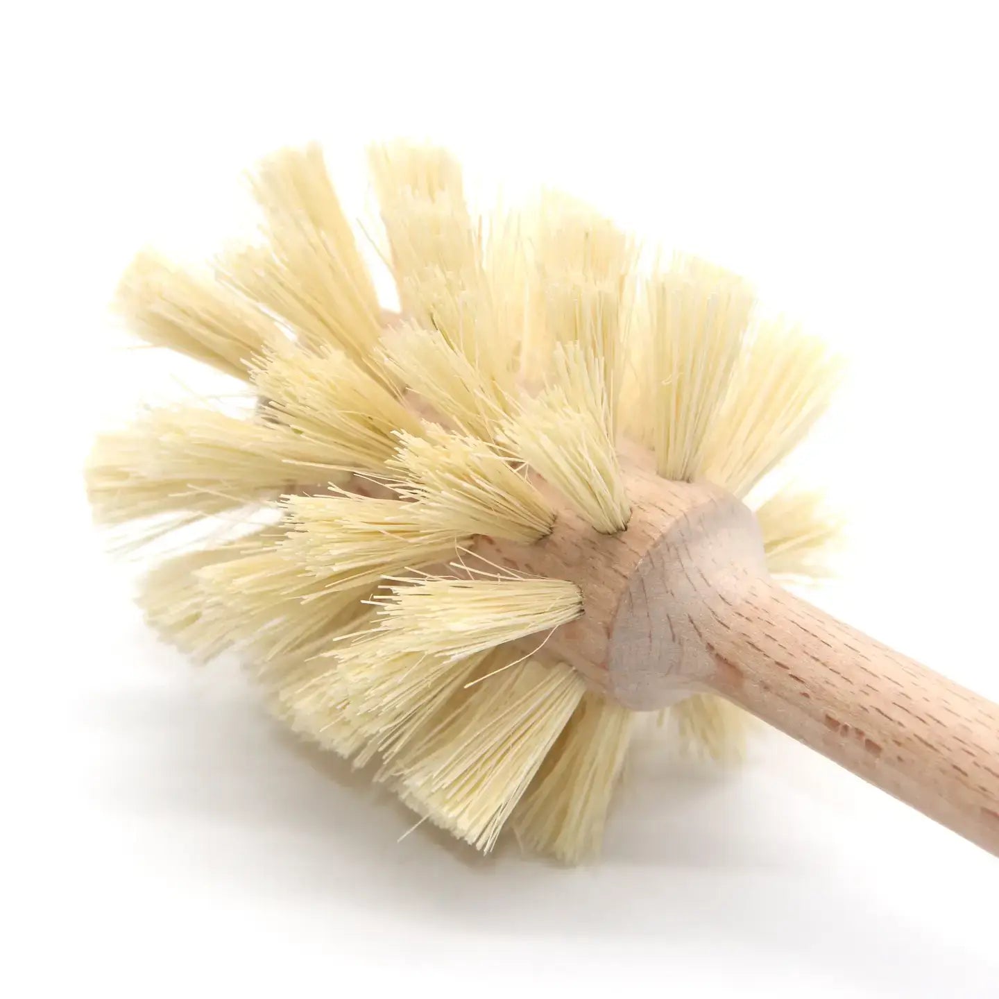 Close-up of a wooden toilet brush with natural bristles on a white background