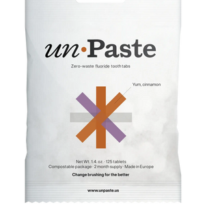Packaging of Unpaste tooth tabs with a green and white color scheme and text indicating the product is zero waste, plastic free, and contains 125 tablets.