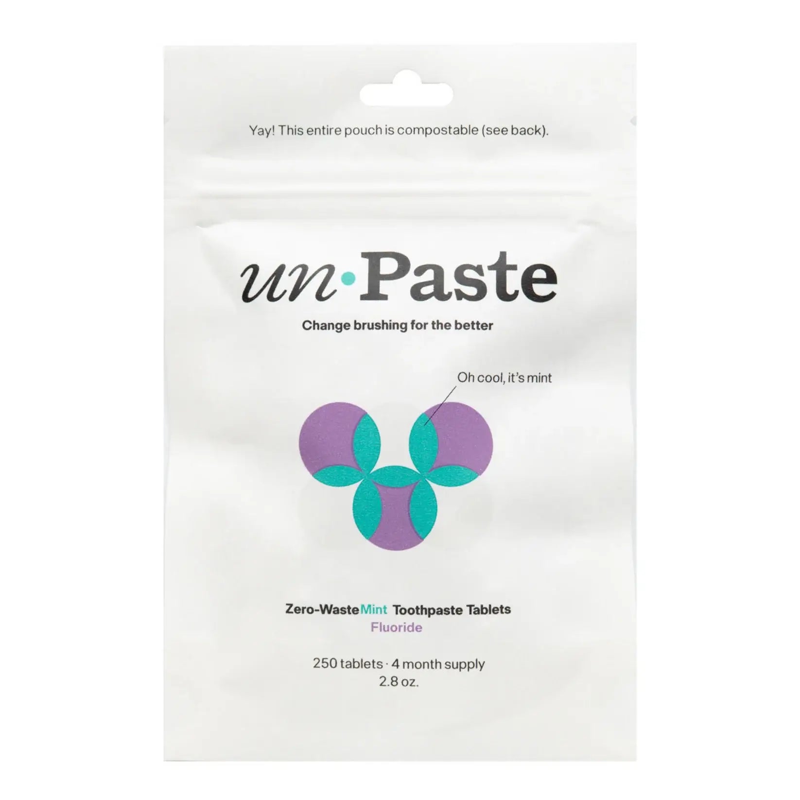 Package of unPaste zero-waste mint toothpaste tablets on a white background