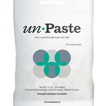 Packaging of Unpaste tooth tabs with a green and white color scheme and text indicating the product is zero waste, plastic free, and contains 125 tablets.