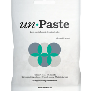 Packaging of Unpaste tooth tabs with a green and white color scheme and text indicating the product is zero waste, plastic free, and contains 125 tablets.