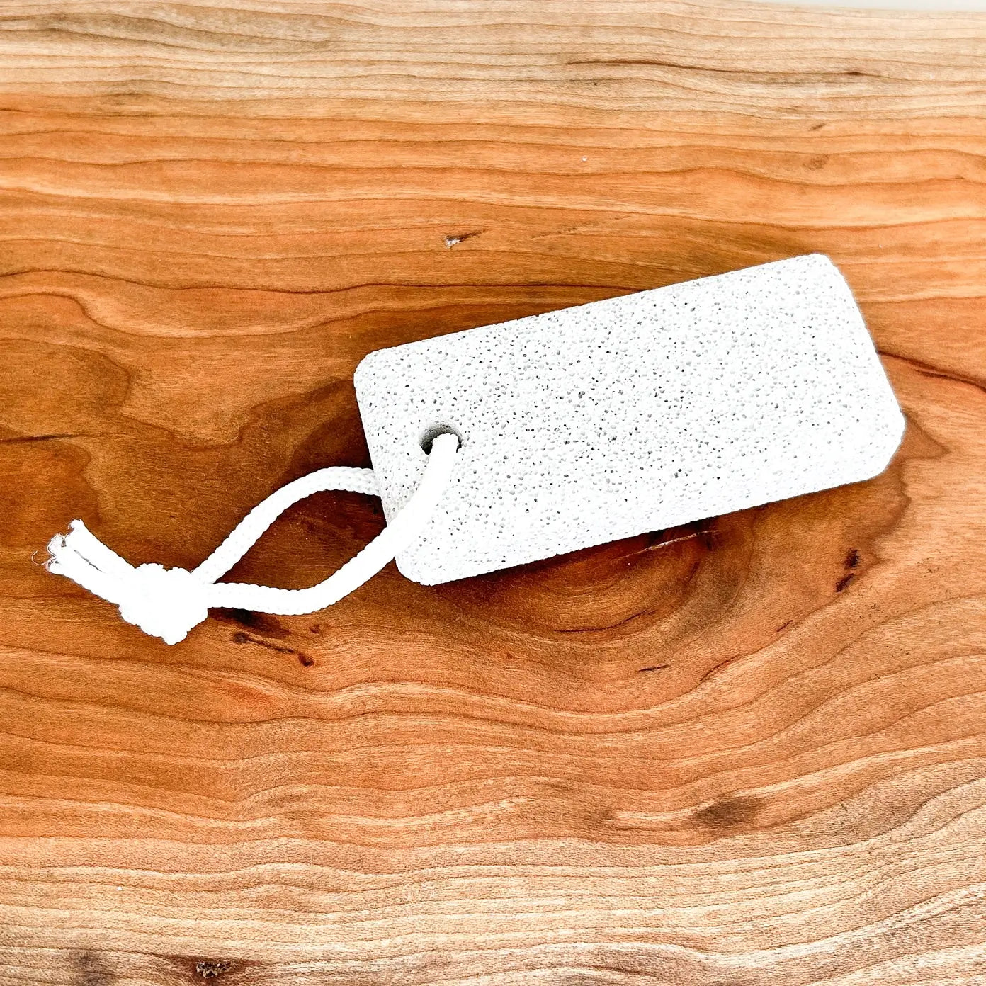 White pumice stone on a wooden surface