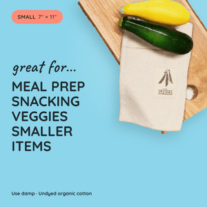 A beige cotton towel pouch with a black veijbag logo, shown on a wooden cutting board with a yellow and green zucchini. The image features a light blue background with text highlighting its use for meal prep, snacking, and storing smaller items.
