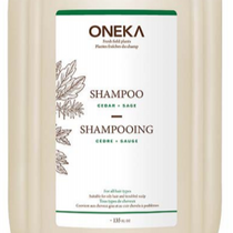 A refillable Oneka shampoo bottle with a label showing the brand name and the word 'Shampooing' in both English and French.