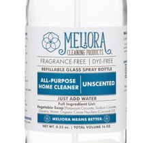 A clear glass spray bottle labeled as All-Purpose Home Cleaner with a blue and white design indicating it is eco-friendly and vegan.
